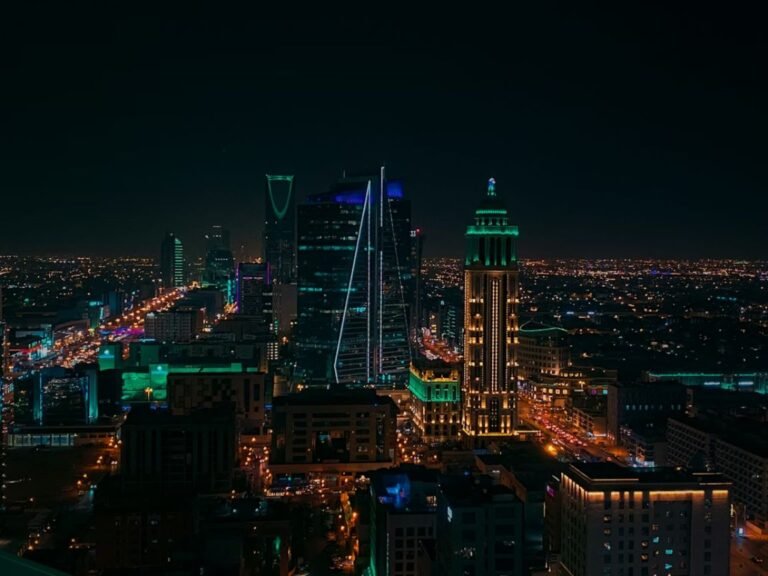 How much salary is enough to live in Riyadh — Riyadh skyline with Al Faisaliyah Tower and King Abdullah Financial District at night