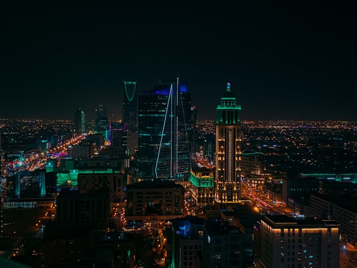How much salary is enough to live in Riyadh — Riyadh skyline with Al Faisaliyah Tower and King Abdullah Financial District at night