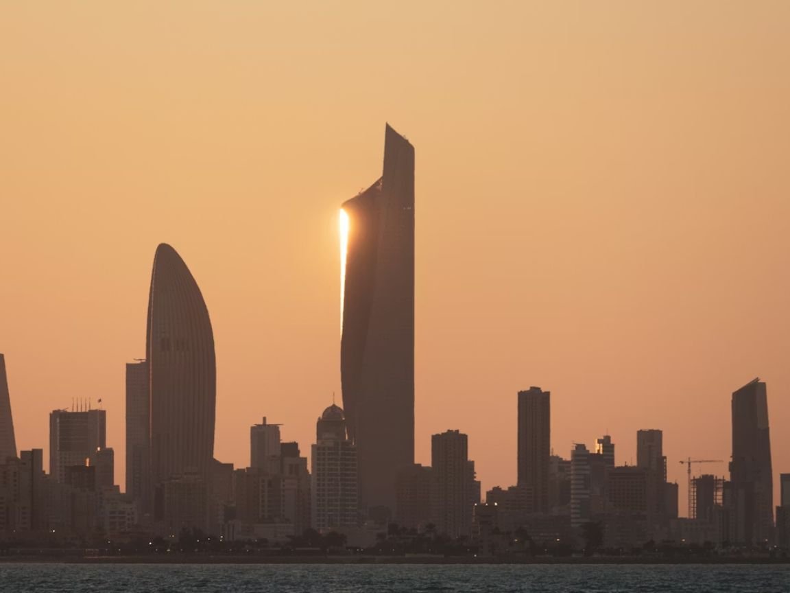 Is 3000 KWD a good salary in Kuwait — Kuwait City skyline at dusk with the Kuwait Towers in the background