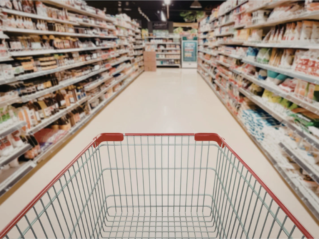 Is 3000 AED a good salary in Dubai. Supermarket aisle in Dubai with grocery products showing everyday food costs for expats