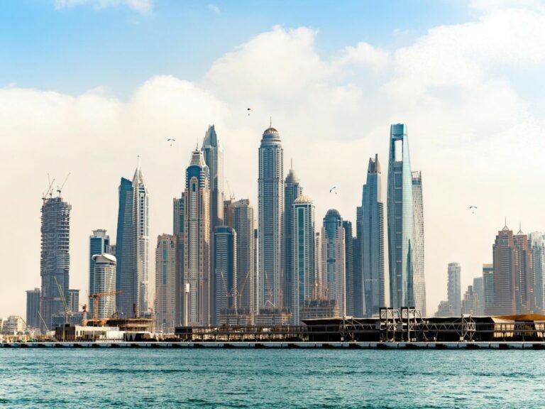 How much money do you need to live comfortably in Dubai — aerial view of Dubai skyline with residential neighborhoods